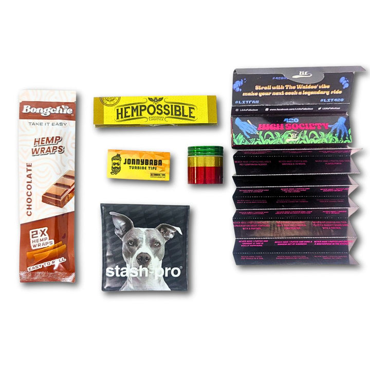 bongchie blunt, metal grinder, stash pro pocket ashtray, lit rolling paper and hempossible rolling paper on a white background.