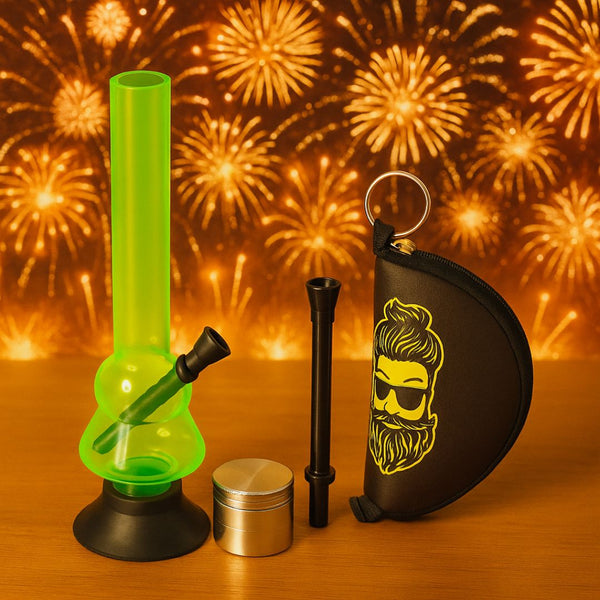 Green acrylic bong with grinder and crushing pouch on a wooden surface with fireworks in the background