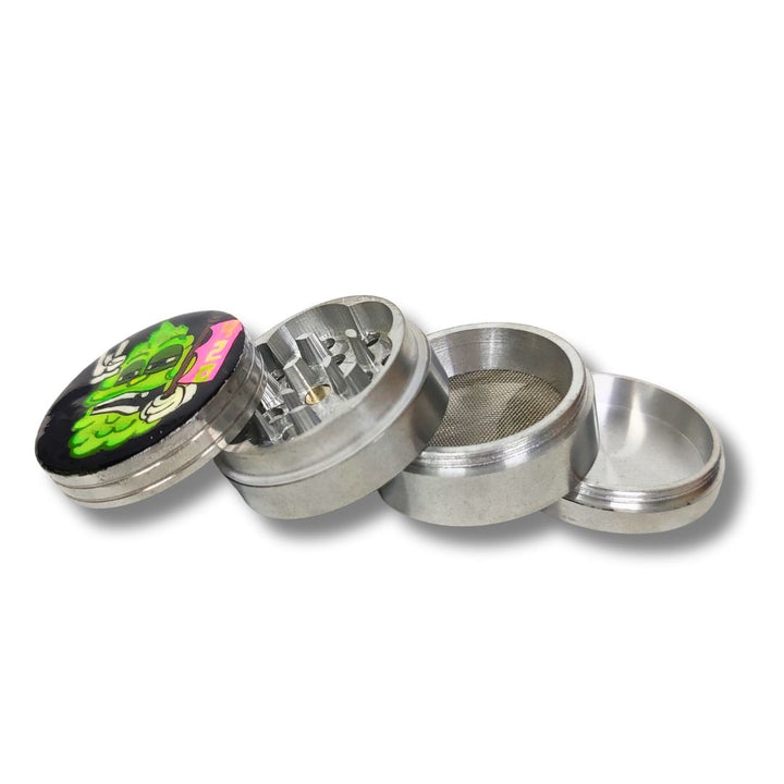 Metallic four-piece herb grinder with a colorful top section on a white background
