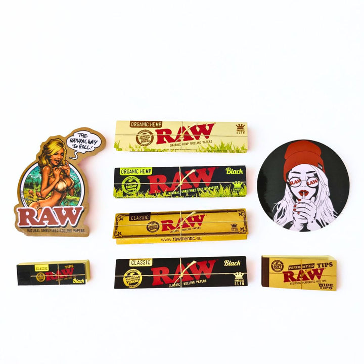 Collection of Raw brand rolling papers and stickers on a white background