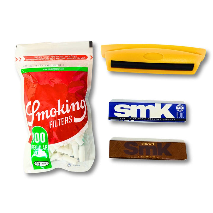 Smoking 22x8 mm filters, a cigarette rolling machine and rolling paper on a white background