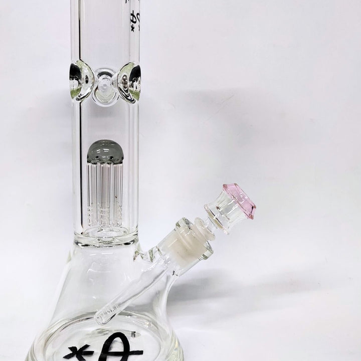 Clear glass water bong with pink accent on a white background