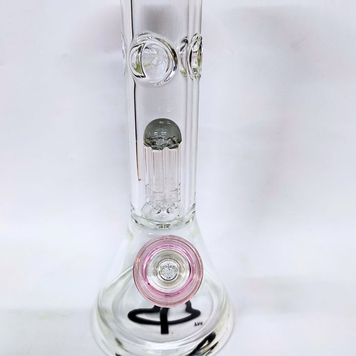 Clear glass water bong with pink base and black logo on a white background