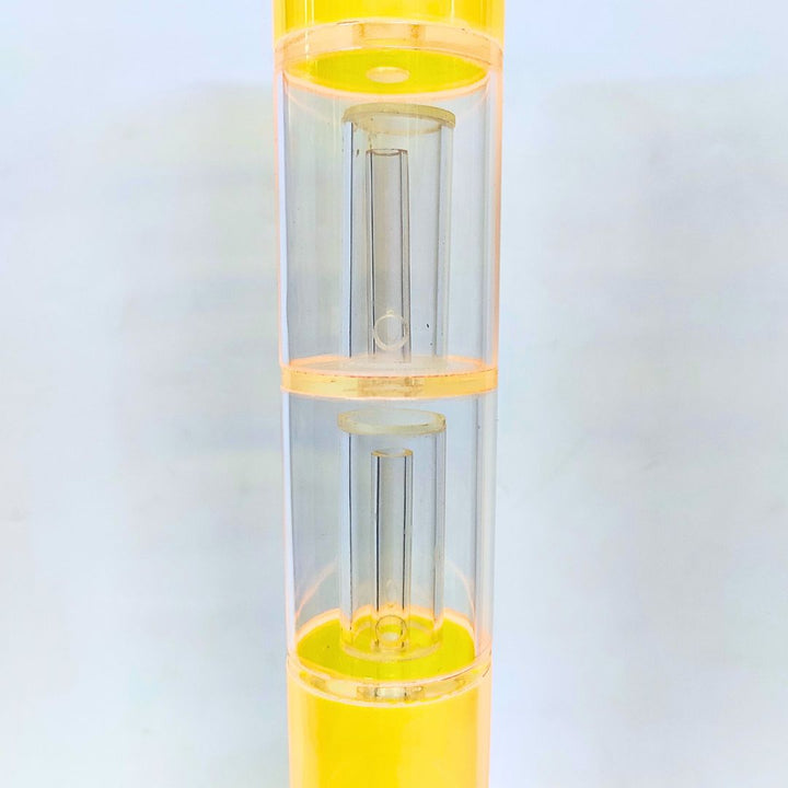 Clear bong percolator with yellow accents on a light gray background