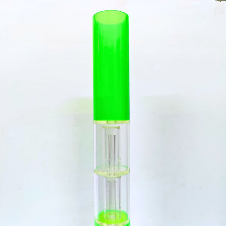 Green and clear bong bottle on a white background