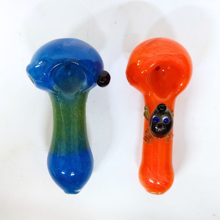 Two glass pipes, one blue and one orange, on a white background