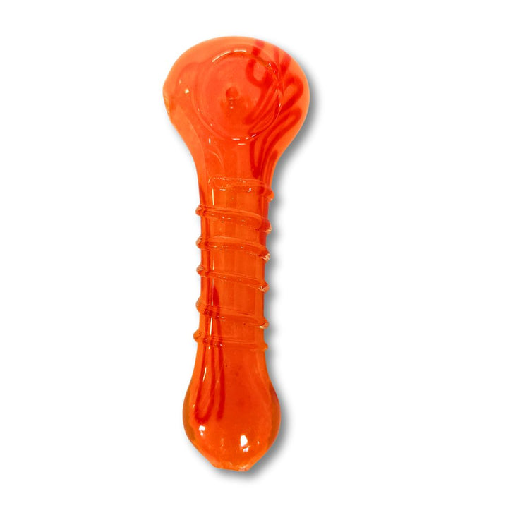 Orange glass spoon on a white background