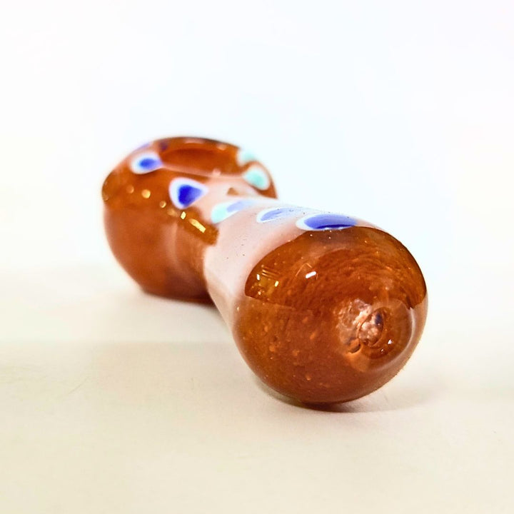 Two glass pipes with brown and blue patterns on a white background