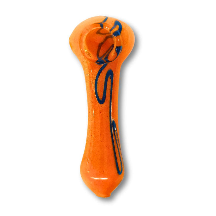 Orange glass pipe with blue designs on a white background