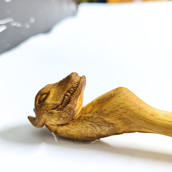 Wooden Chillum Poker on a white surface