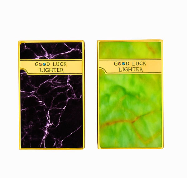 Two 'Good Luck Lighters , one with purple marble pattern and the other with green marble pattern, on a white background.