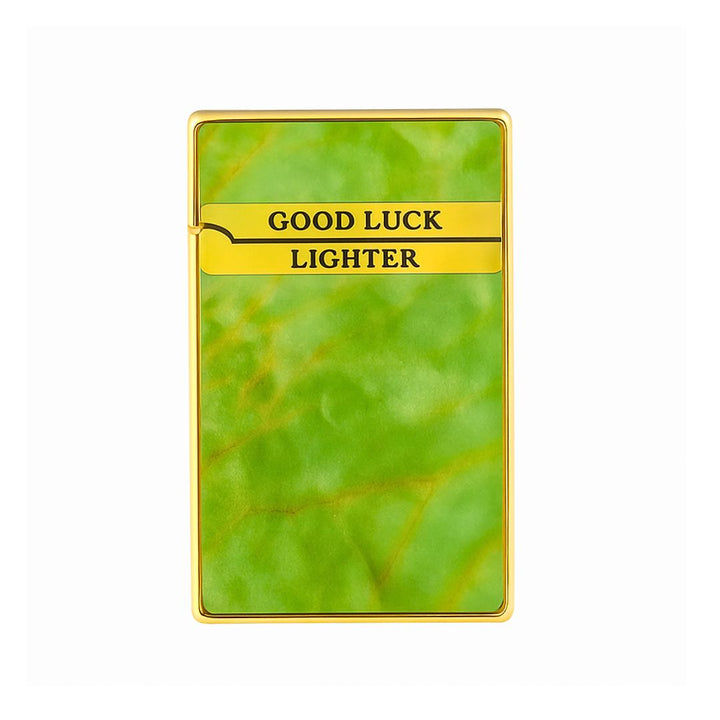 Good Luck lighter with green leaf pattern and gold trim on a white background