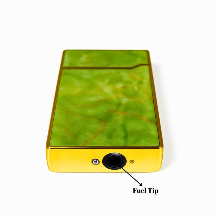 Green and yellow device with a fuel tip labeled on a white background
