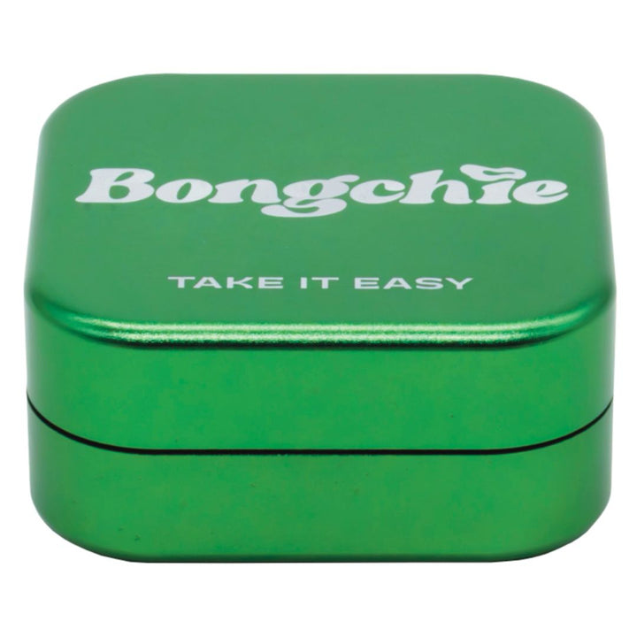 Green metal herb Grinder with 'Bongchie' and 'Take It Easy' text on a white background