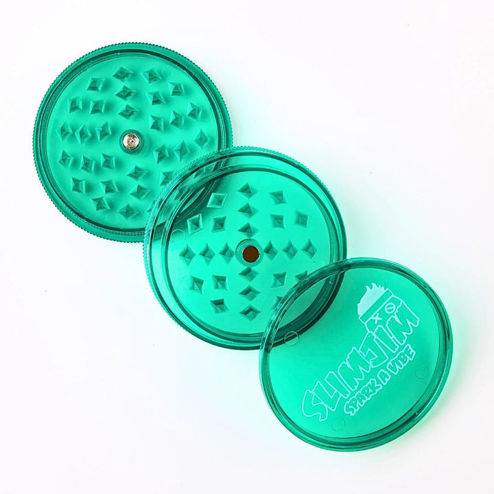 Green transparent grinder with textured design on a white background