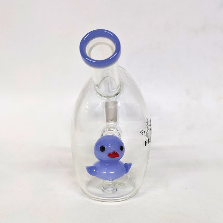 Glass bottle with a blue rubber duck inside on a white background