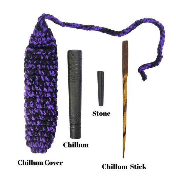 Chillum set with chillum cover, stone, and chillum stick on a white background