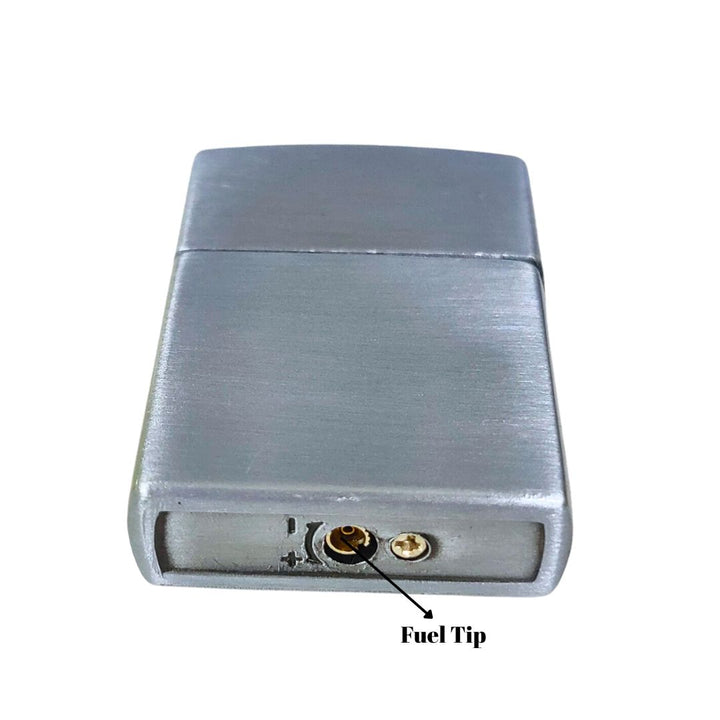 Metallic lighter with fuel tip labeled on a white background