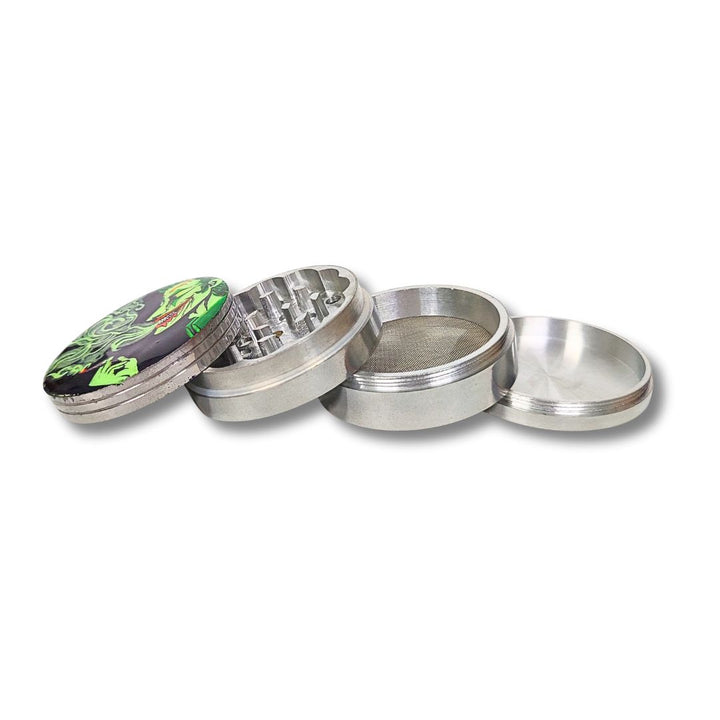 Metallic herb grinder with a colorful top section on a white background
