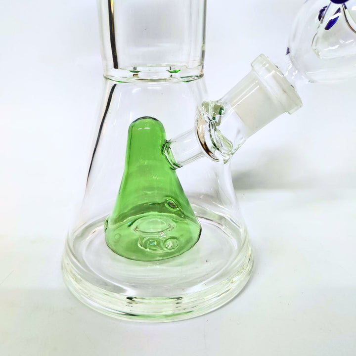 Glass bong with a green accent on a white background