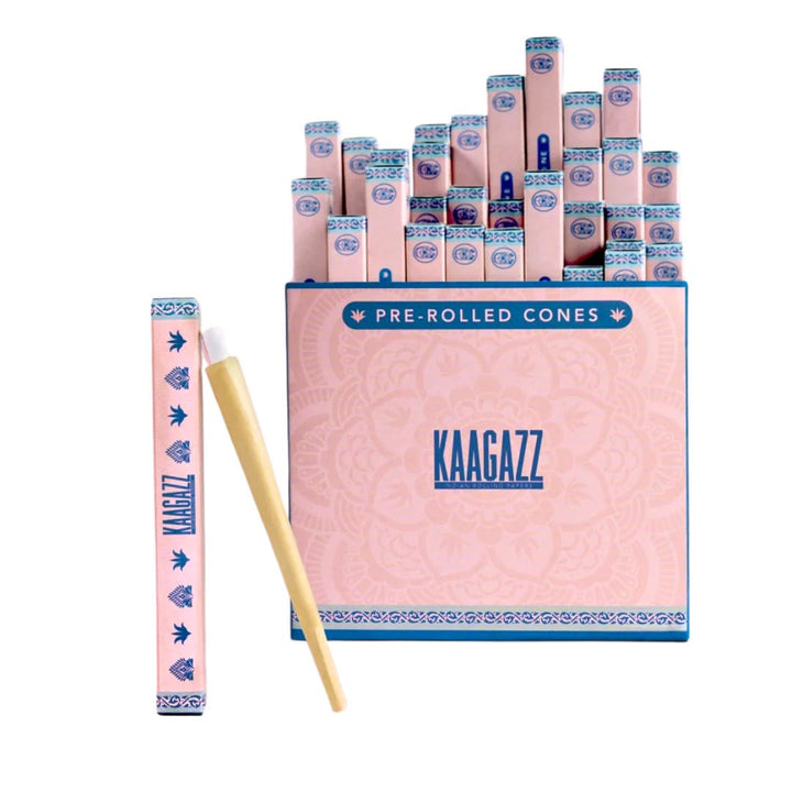 Pink packaging of pre-rolled cones with 'KAAGAZZ' branding on a white background