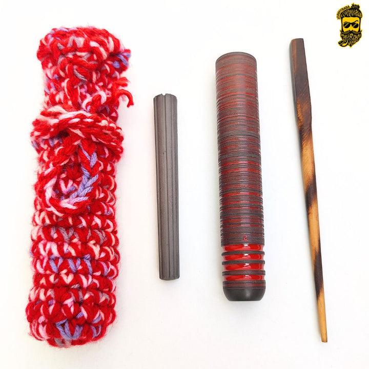 Kaio Italian chillum with cleaning stick, cover and stone on a white background.