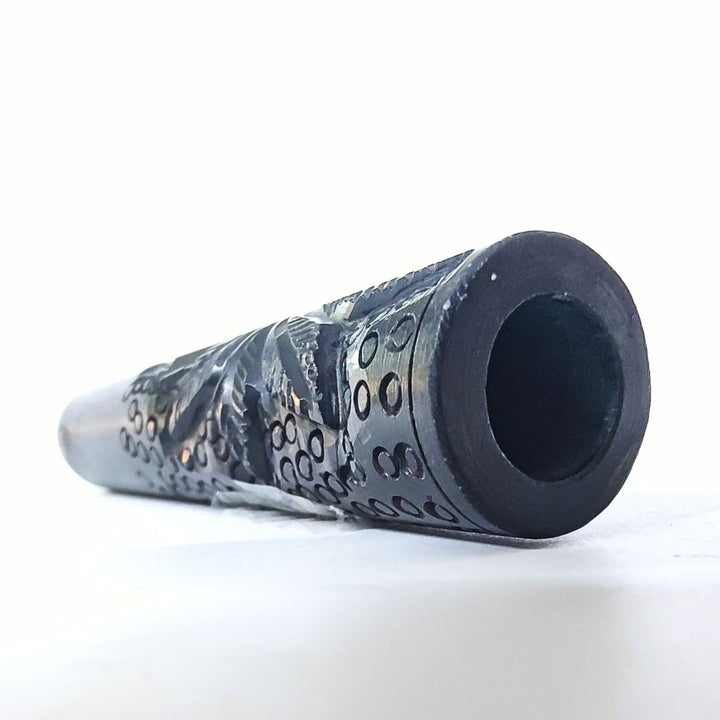 Black textured Chillum on a white background