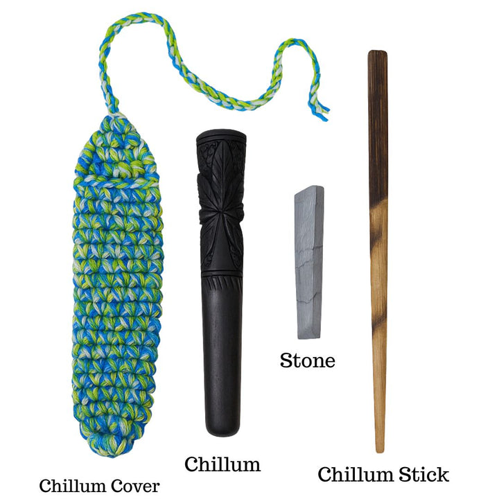 Chillum set with cover, chillum, stone, and stick on a white background