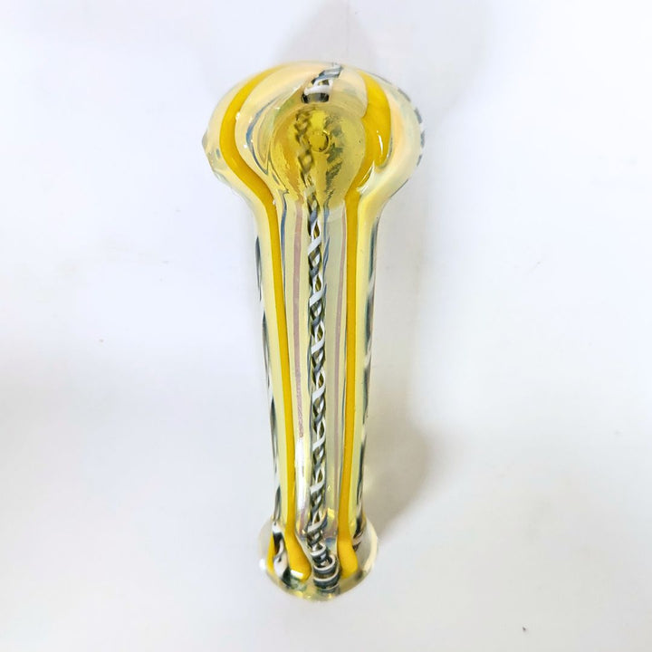 Glass pipe with yellow and clear design on a white background