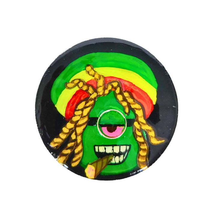 Herb Crusher with a colorful design featuring green, red, yellow, and black on a white background.