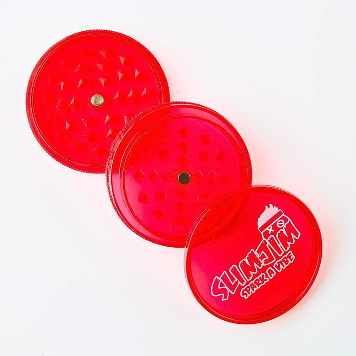 Red plastic grinder with 'Slimjim' branding on a white background