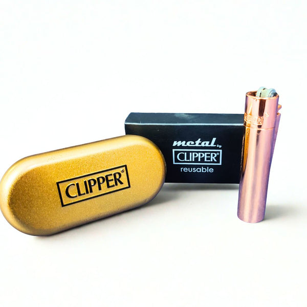 Clipper case and rose gold lighter on a white background