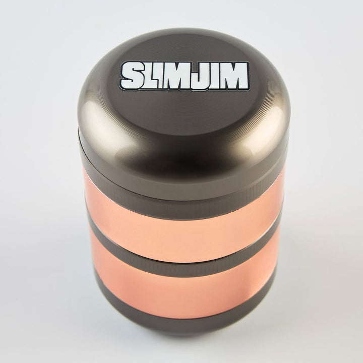 Metallic grinder with 'SLIMJIM' branding on a light gray background