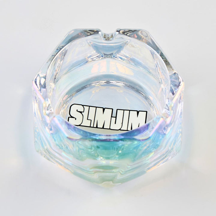 Iridescent glass ashtray with 'SLIMJIM' branding on a light gray background