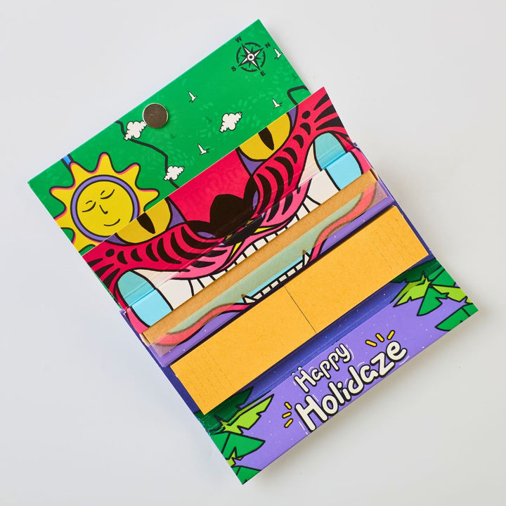 Colorful Rolling Paper with a tiger design and 'Happy Holidaze' text on a white background