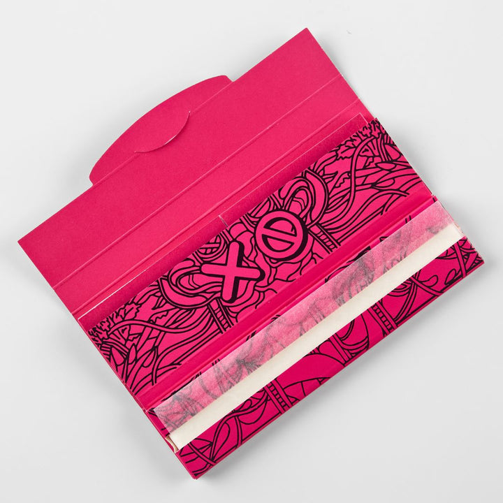 Slimjim rolling paper holder with black designs on a white background