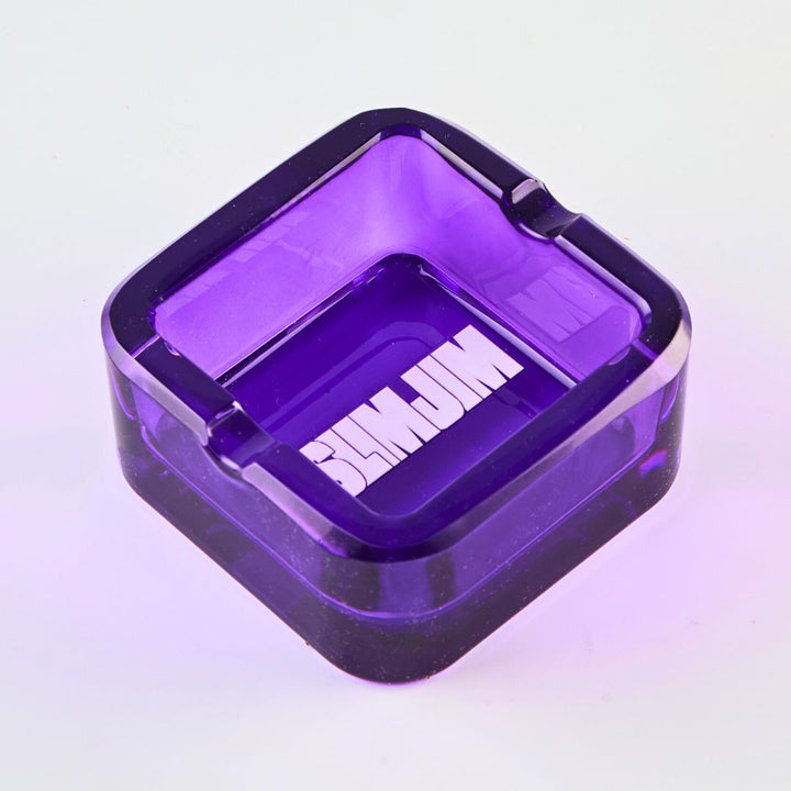 Purple transparent ashtray with 'Slimjim' branding on a light purple background