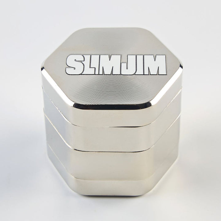 Hexagonal metal Grinder with 'SLIMJIM' branding on a light gray background