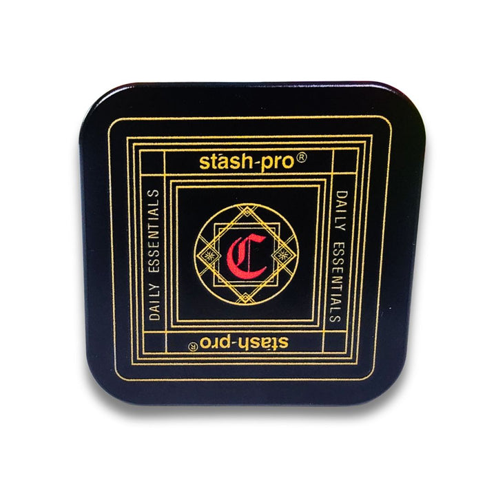 Black metal grinder with gold and red design featuring 'stash-pro' branding on a white background