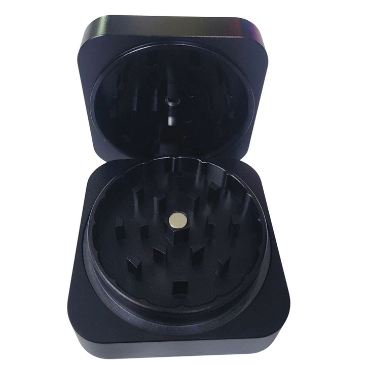 Black weed grinder with open lid on a white background