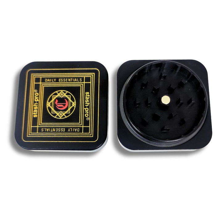 Black weed crusher with gold accents on a white background