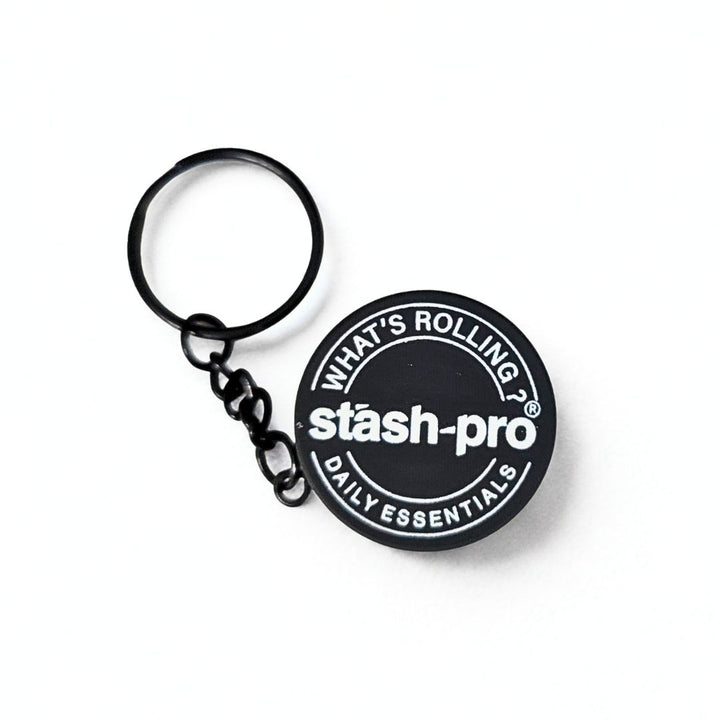 Black keychain Grinder  with 'stash-pro' logo on a white background