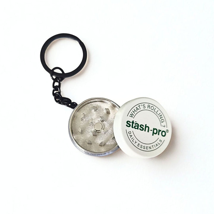 Stash-Pro keychain with a small Grinder on a white background