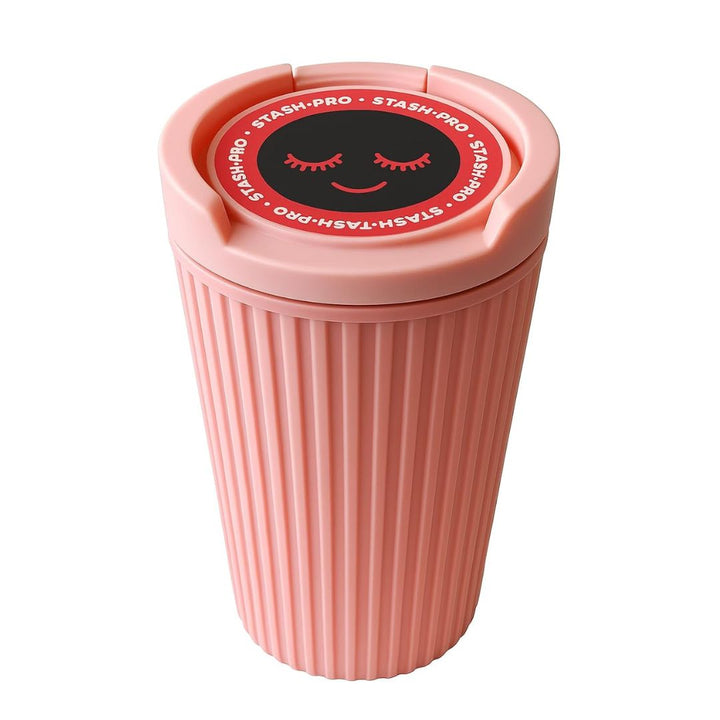 Pink car ashtray with a smiley face design on the lid against a white background