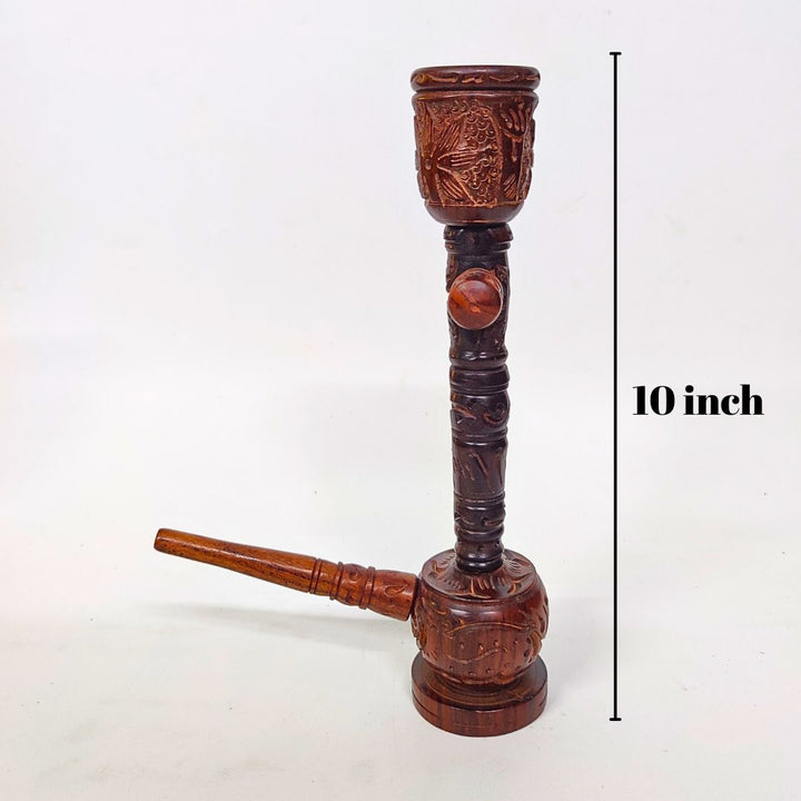 Wooden pipe with intricate carvings and measurement label on a white background