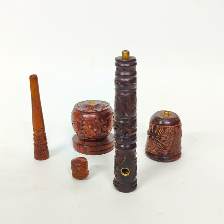 Set of wooden smoking accessories on a white background