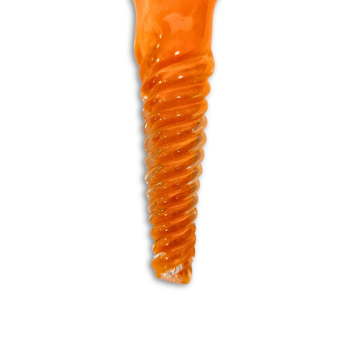 Orange spiral-shaped object on a white background