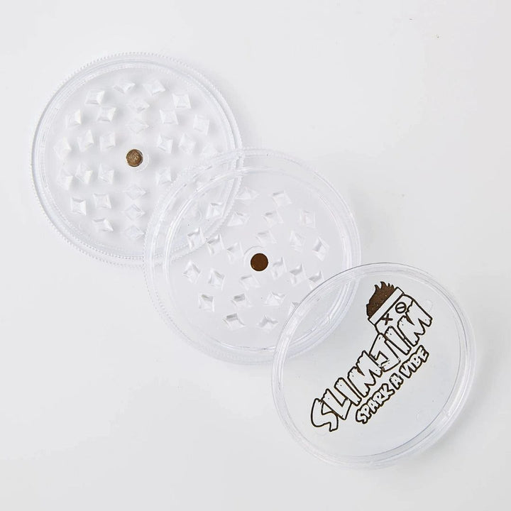 Clear plastic grinder with branded text on a white background
