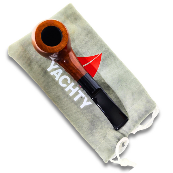 Wooden pipe with black accent on a Yachty branded cloth bag.
