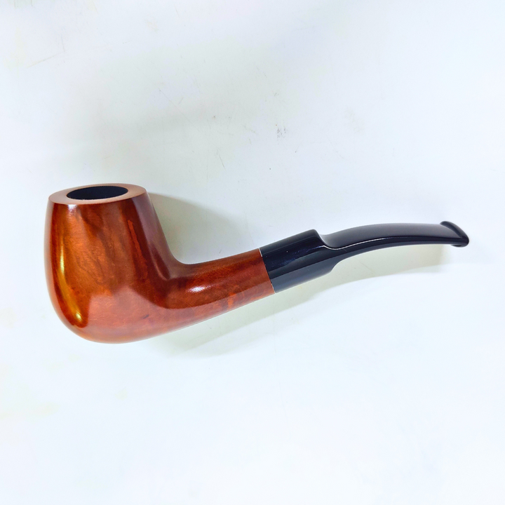 Wooden pipe with black accent on a white background